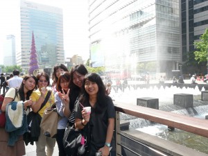 Us with our new friends eating Baskin Robbins ice-cream along Cheonggyecheon in Seoul