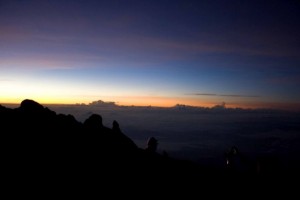 Witnessing dawn over a low peak